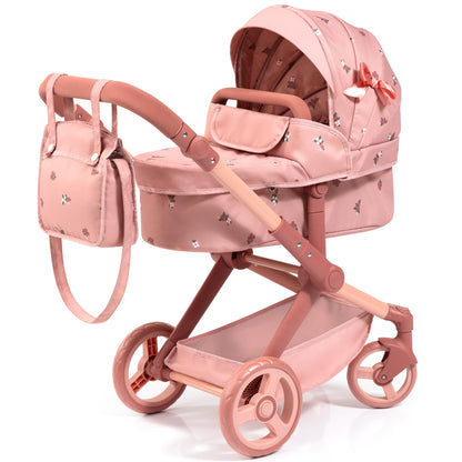 Coral pink doll pram with floral pattern, includes carriage with hood, lower basket, and matching shoulder bag