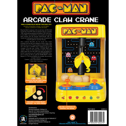 Pac-Man Arcade Claw Crane yellow handheld game with joystick controls and prize capsules