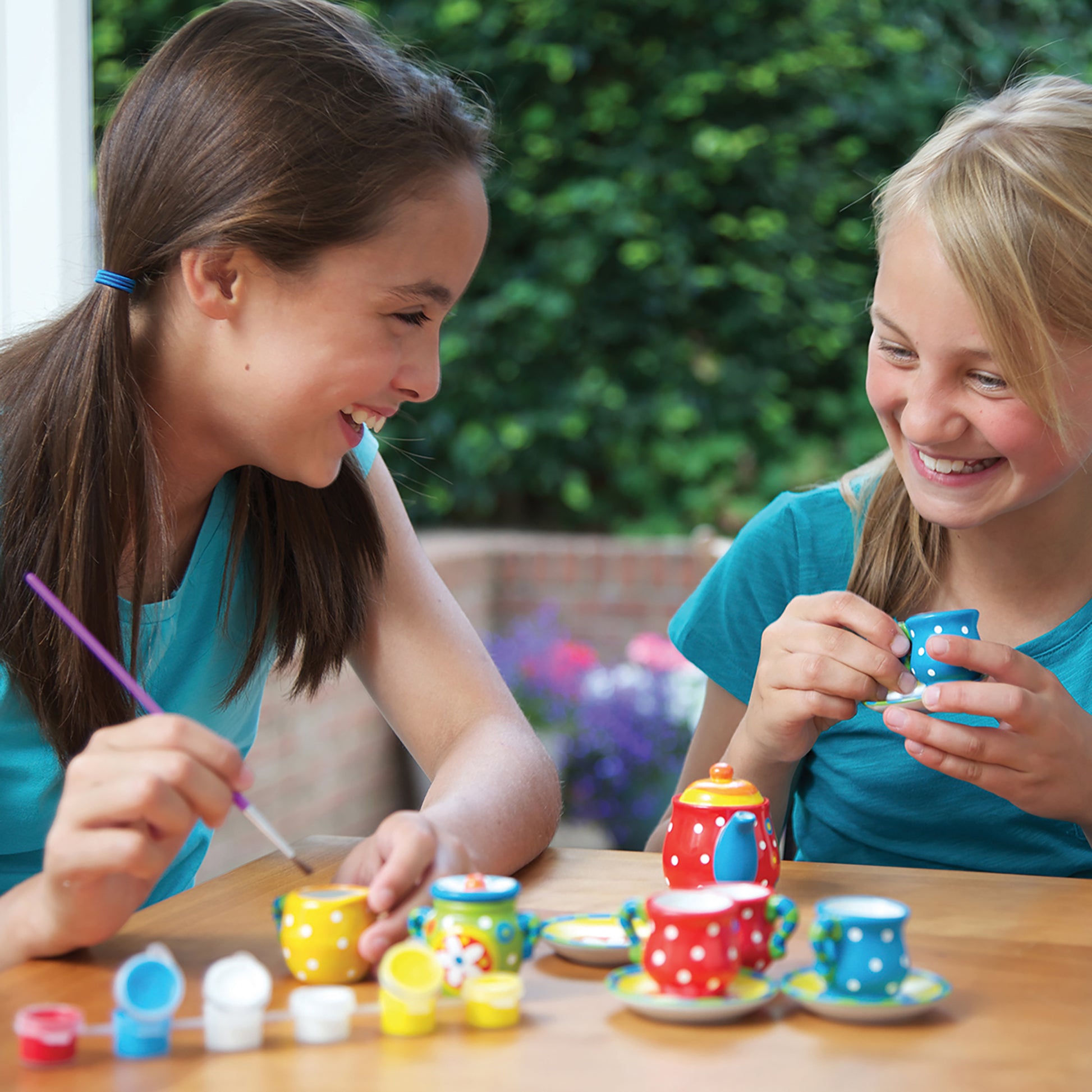 KidzMaker Paint Your Own Mini Tea Set with colorful polka dot pieces