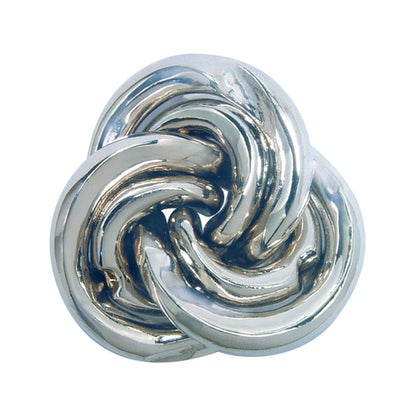 Silver metal puzzle with interlocking curved pieces forming a swirling, abstract shape