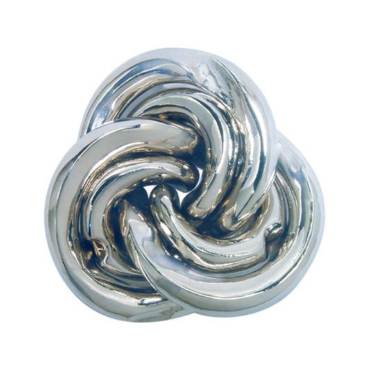 Silver metal puzzle with interlocking curved pieces forming a swirling, abstract shape