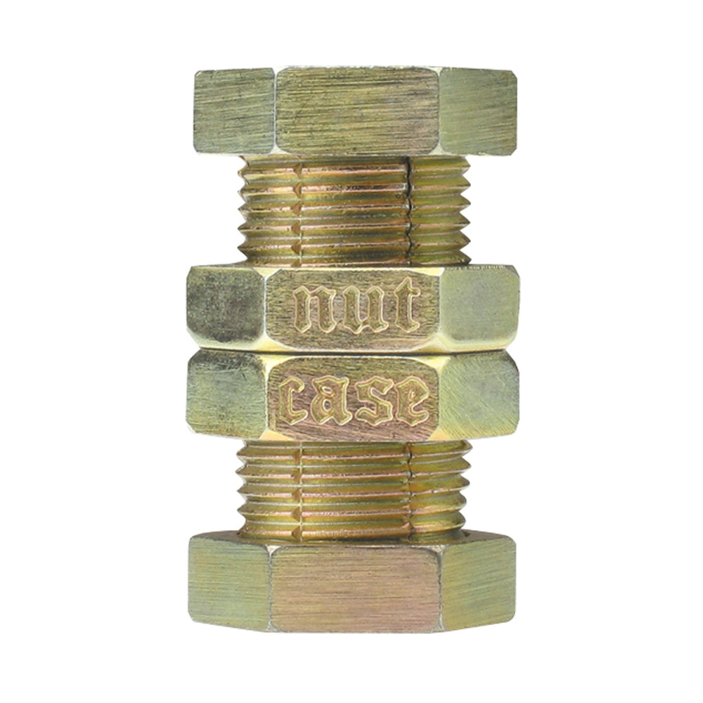 Brass bolt and nut metal puzzle with embossed text, stacked components on plain background