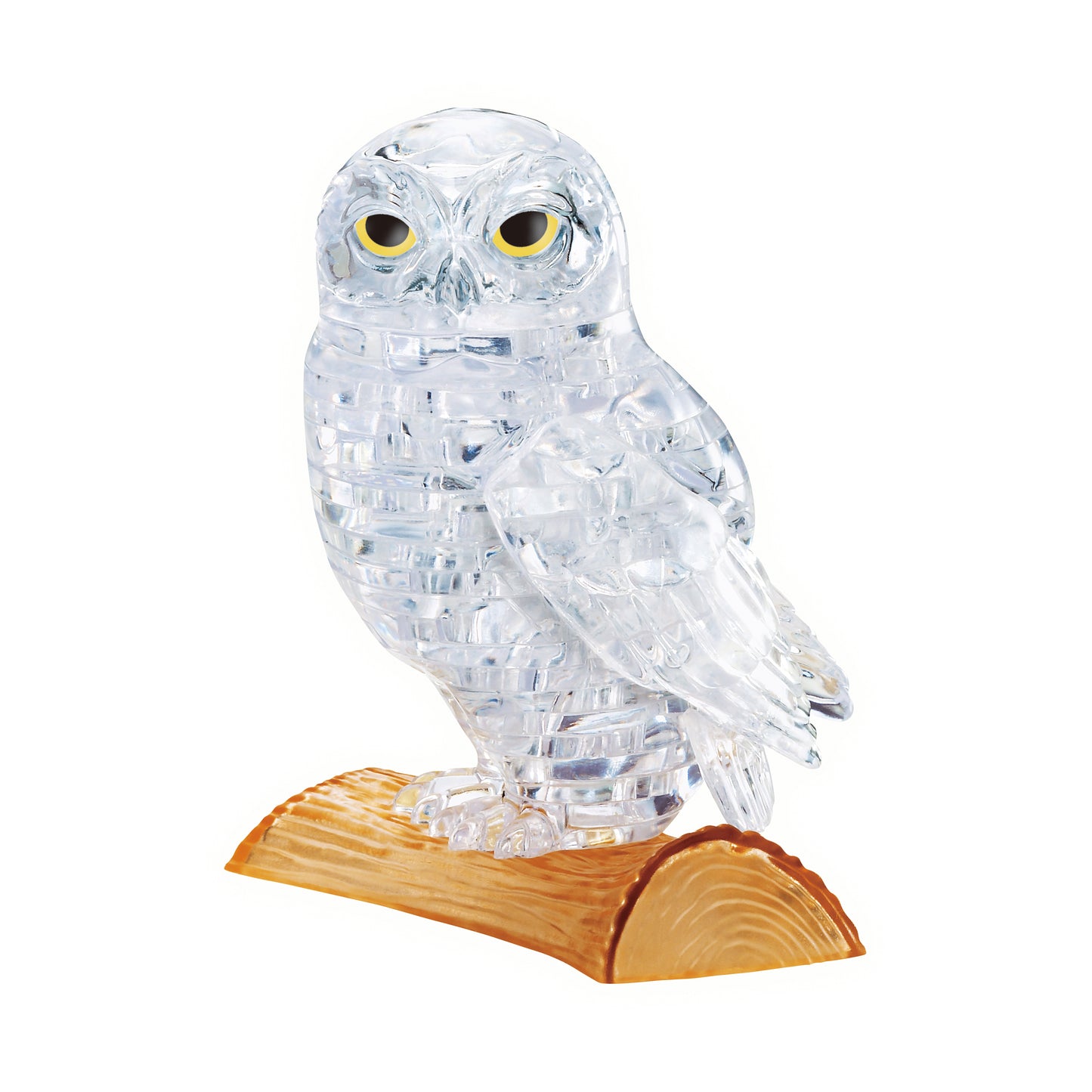 Clear crystal 3D puzzle owl with yellow eyes, assembled and displayed on a wooden perch base