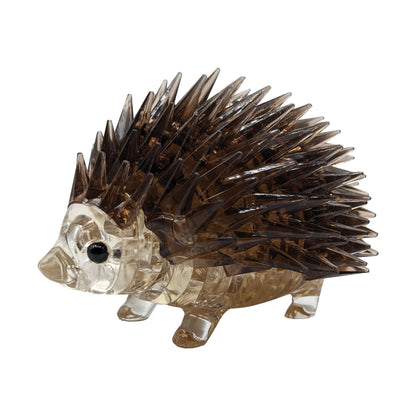 3D crystal puzzle hedgehog with translucent tan body and dark brown spiky quills on plain background