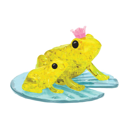 Two yellow translucent crystal frogs on a blue lily pad base, larger frog wearing a pink crown
