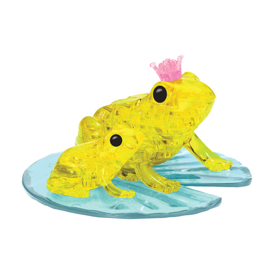 Two yellow translucent crystal frogs on a blue lily pad base, larger frog wearing a pink crown