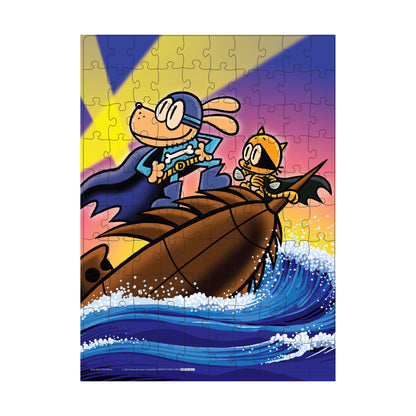 Dog Man and Petey the Cat riding on a giant sea creature with a colorful sunset sky and ocean waves below, shown as a 100-piece jigsaw puzzle