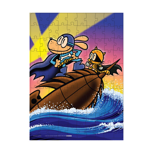 Dog Man and Petey the Cat riding on a giant sea creature with a colorful sunset sky and ocean waves below, shown as a 100-piece jigsaw puzzle