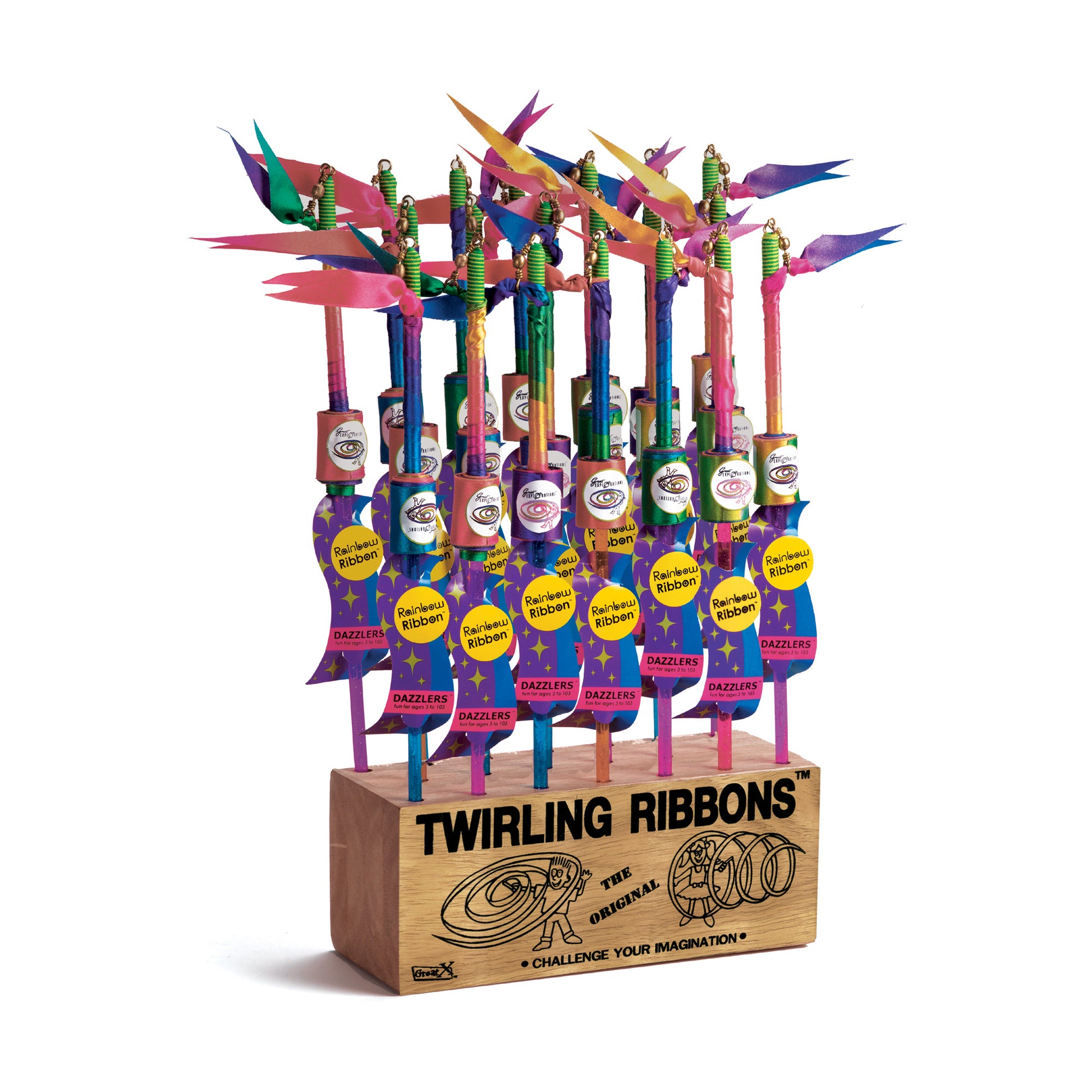 Twirling Ribbons display with multiple colorful ribbon wands in wooden base, featuring green handles, rainbow-colored ribbons, and yellow "Rainbow Ribbon" label