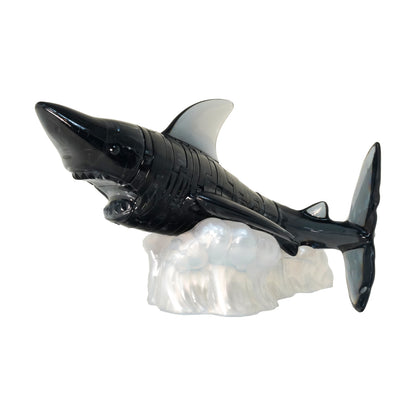 Black shark figurine with gray fins mounted on clear crystal puzzle base, 38-piece 3D puzzle set