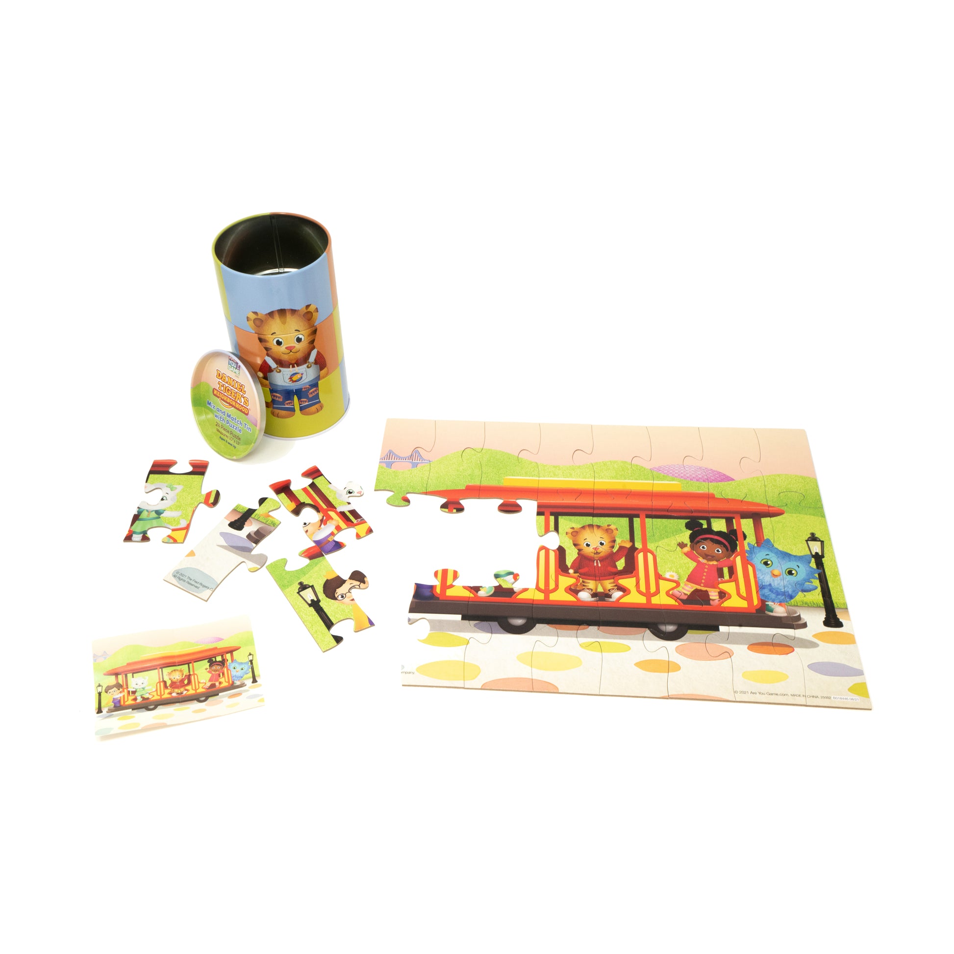 Daniel Tiger's Neighborhood 24 pc Mix and Match Tin Puzzle with colorful pieces and storage container