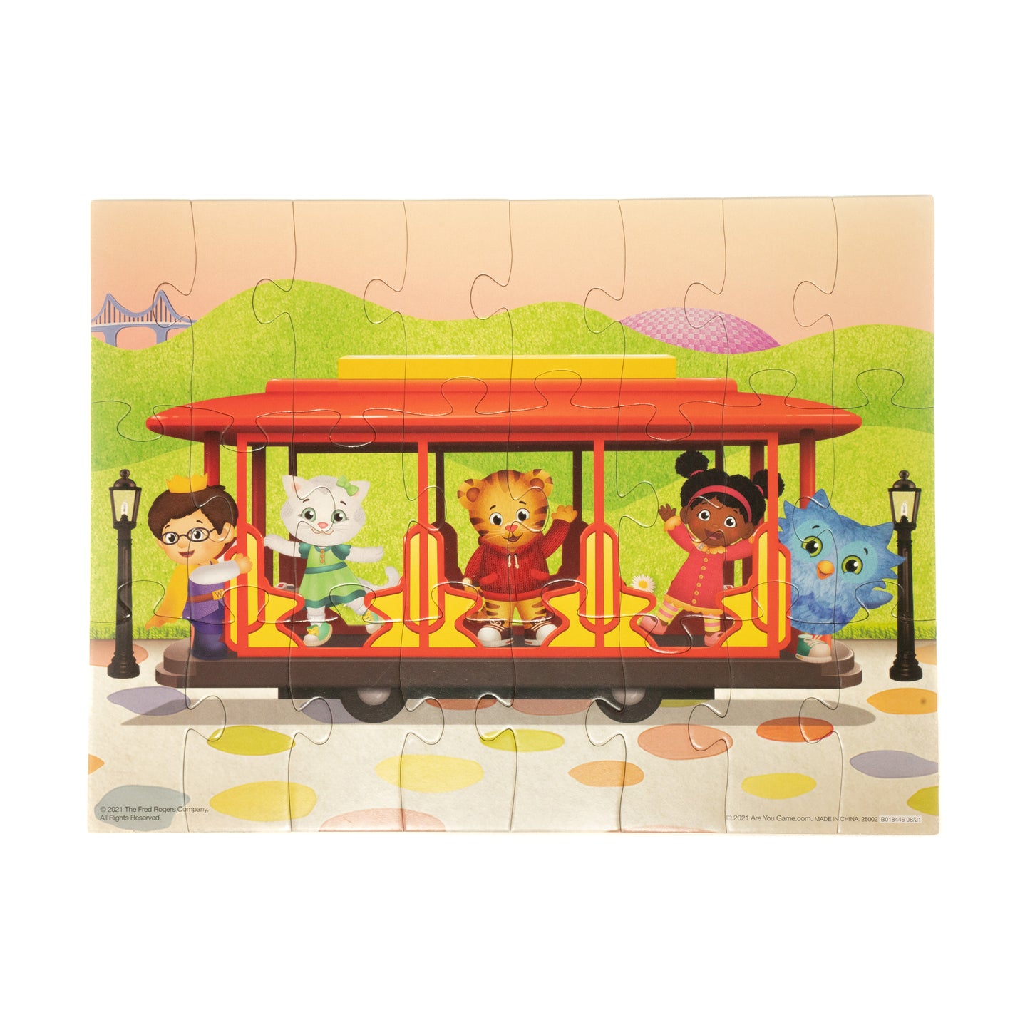 Daniel Tiger's Neighborhood 24 piece puzzle showing colorful trolley with characters in green park setting