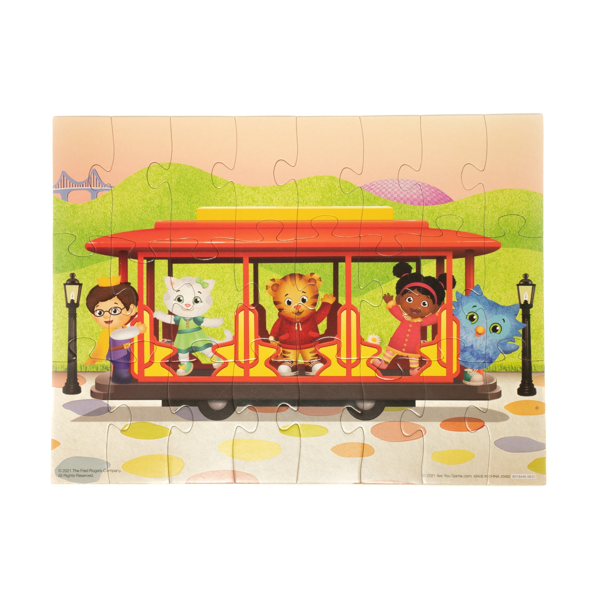 Daniel Tiger's Neighborhood 24 piece puzzle showing colorful trolley with characters in green park setting