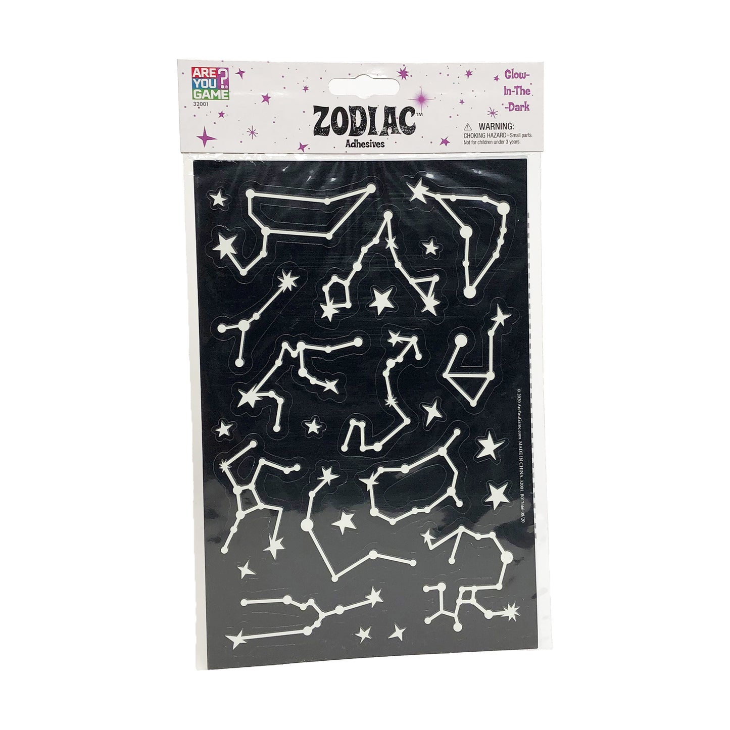 Glow-in-the-dark zodiac adhesive shapes set featuring white constellation outlines and stars on black background, packaged in labeled header card