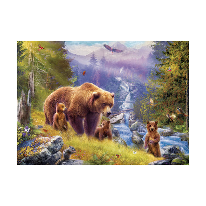 Illustrated forest scene with a mother bear and three cubs in a meadow beside a stream, surrounded by tall trees, mountains, birds, and small woodland animals