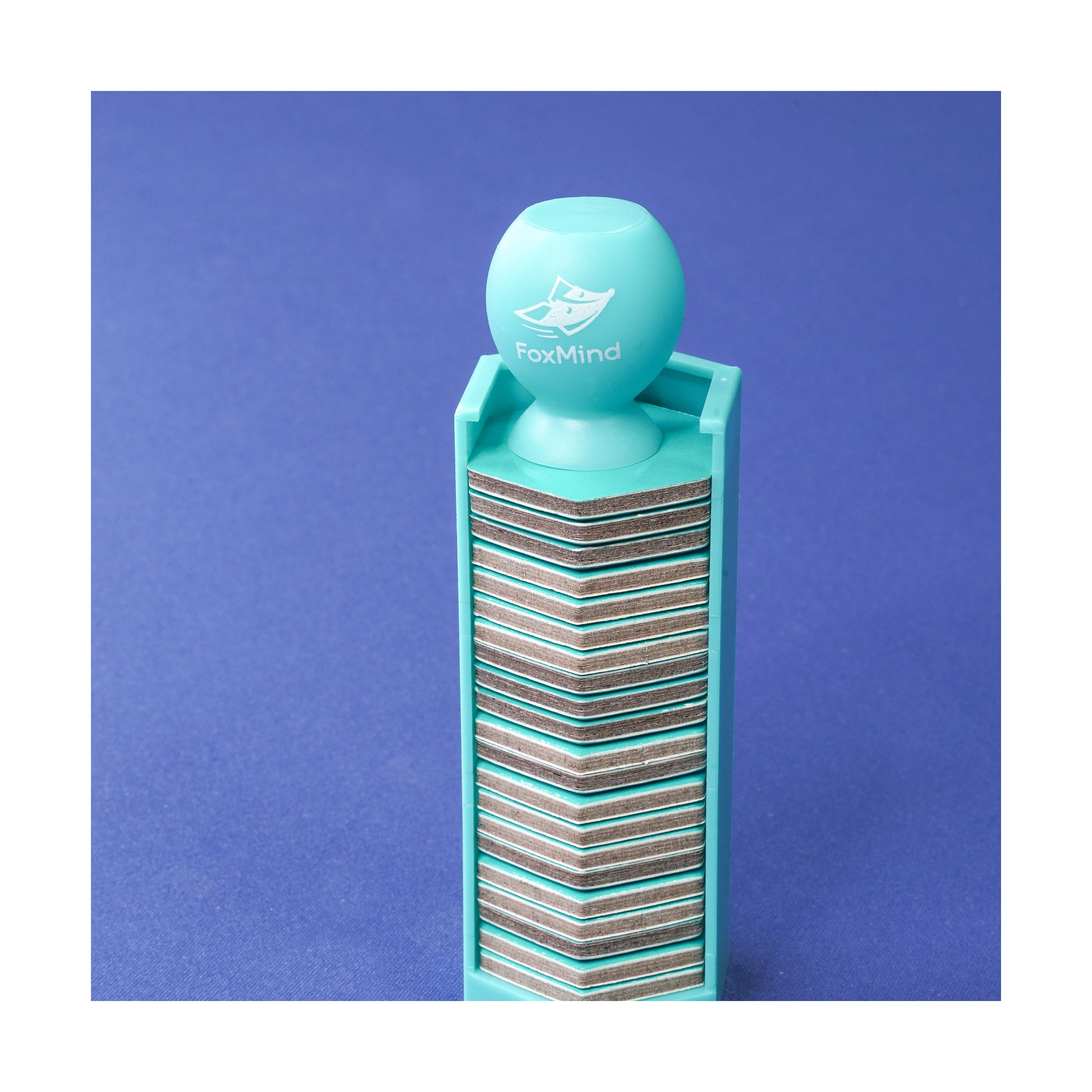FoxMind Six-O stacking game with turquoise sphere top and layered wooden base