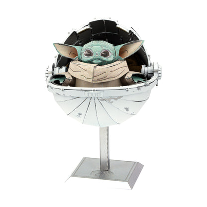 Metal Earth ICONX 3D model kit featuring The Child in a hovering pod with opening dome, displayed on stand