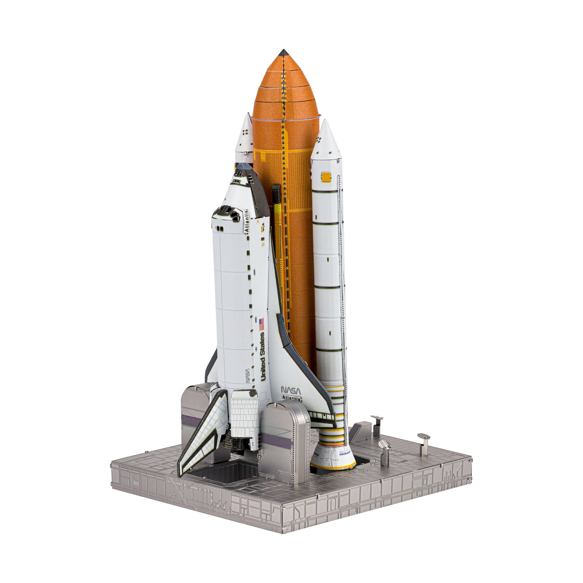 Metal Earth ICONX 3D Space Shuttle Launch model kit assembled and displayed on gray launch pad base, showing white orbiter with orange fuel tank and boosters