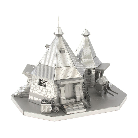 Metal Earth 3D metal model kit of Rubeus Hagrid's Hut from Harry Potter, featuring detailed silver-gray metal construction with peaked roofs, turrets, stone wal
