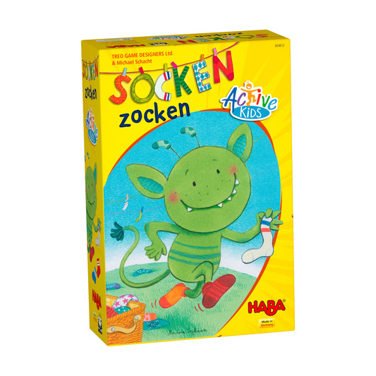 Socken Zocken Active Kids sock-tossing game box with yellow background, featuring a green smiling monster character with striped body and colorful socks