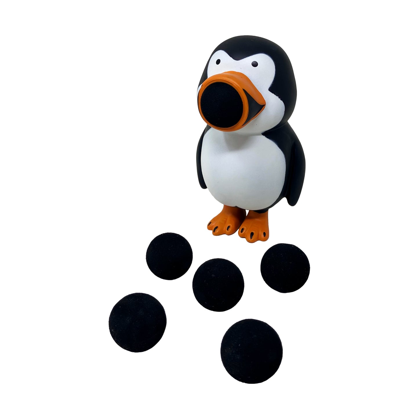Penguin Popper toy with black and white body, orange beak and feet, shooting black balls