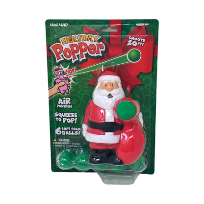 Hog Wild Holiday Popper Santa launcher toy in red and white with black belt, includes 6 soft foam balls, air-powered squeeze-to-pop action, ages 4+