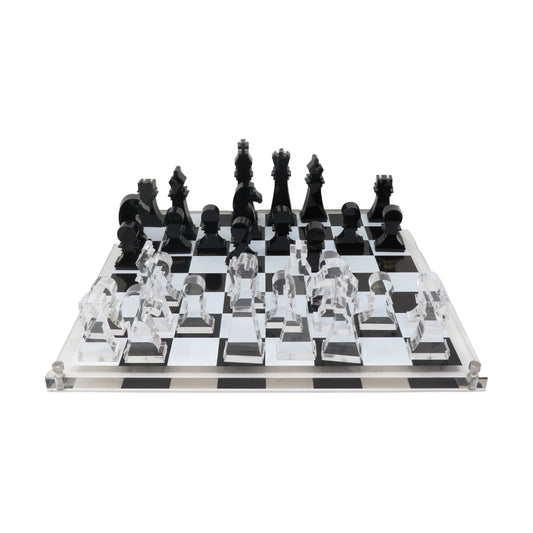 Classic acrylic chess set with black and clear pieces on checkered board with acrylic base