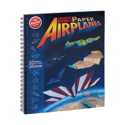 The Klutz Book of Paper Airplanes spiral-bound book with dark blue cover featuring colorful paper airplane designs in flight and 40 sheets of full-color paper i