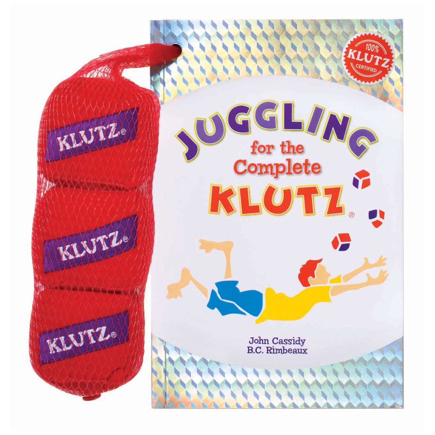 Juggling for the Complete Klutz book next to red mesh bag containing three juggling balls with purple Klutz branding
