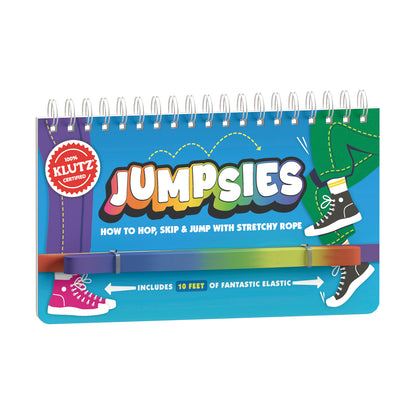 Jumpsies spiral-bound activity book with colorful rainbow gradient elastic rope attached, showing illustrated sneakers and text 'How to Hop, Skip & Jump with St