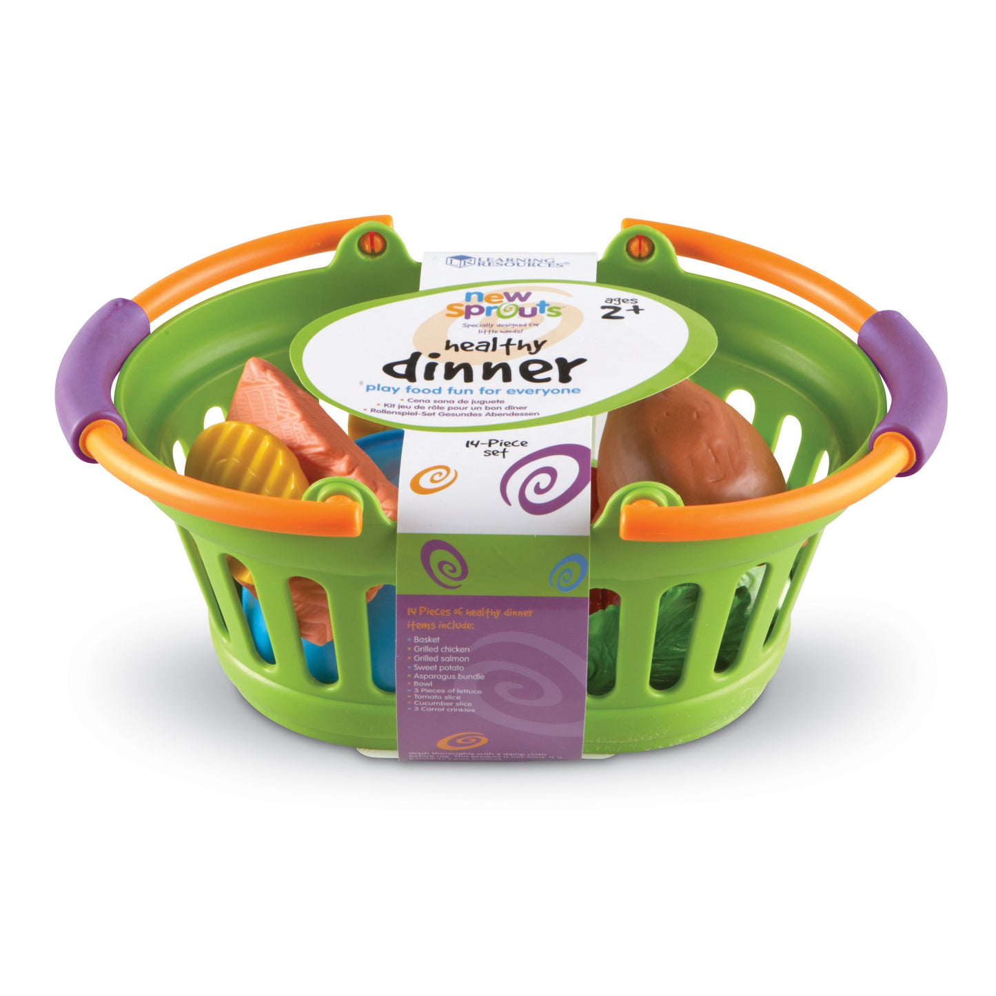 New Sprouts Healthy Dinner play food set in green basket with orange handles, including plastic salmon, chicken, sweet potato, and other food pieces