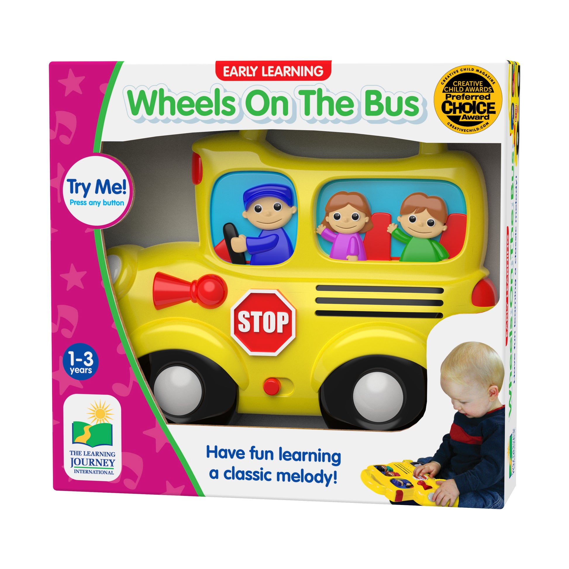 Yellow school bus toy with driver figure in blue cap, two child figures in windows, red stop sign, horn, and black wheels. Box shows ages 1-3 and Creative Child