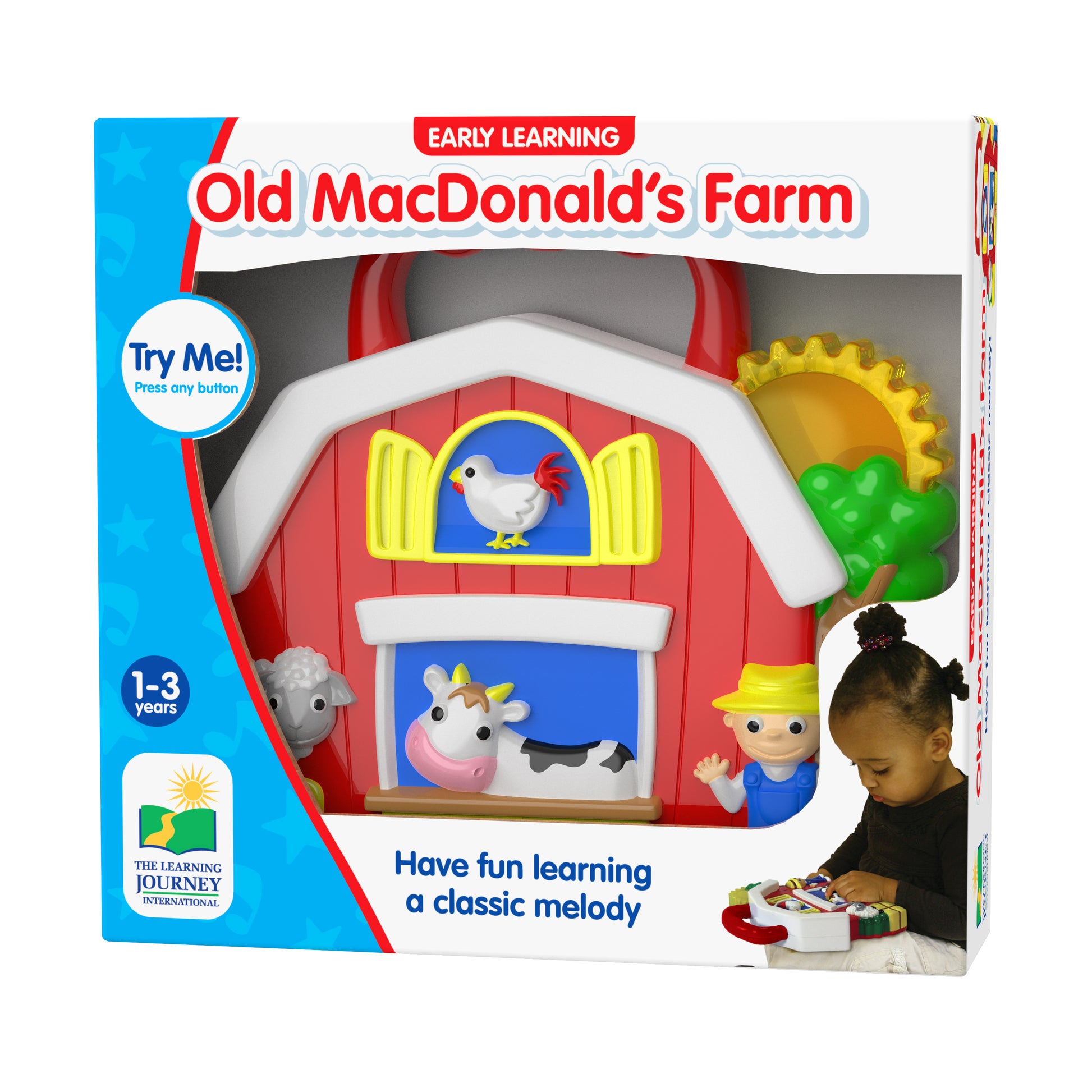 Early Learning Old MacDonald's Farm interactive toy barn with red roof, pop-up animal figures, and button to play classic melody, modeled by a child