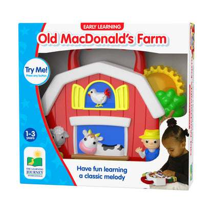 Early Learning Old MacDonald's Farm interactive toy barn with red roof, pop-up animal figures, and button to play classic melody, modeled by a child