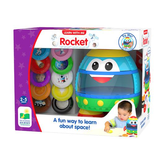 Learn with Me Rocket interactive toy with stacking rings, featuring a colorful rocket character with big eyes and yellow top, modeled by a child