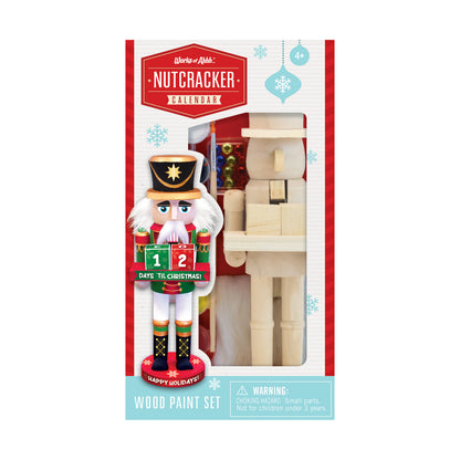 Works of Ahhh Nutcracker Calendar wood paint set with unpainted wooden nutcracker figure, countdown calendar showing 12 days till Christmas, and paint supplies