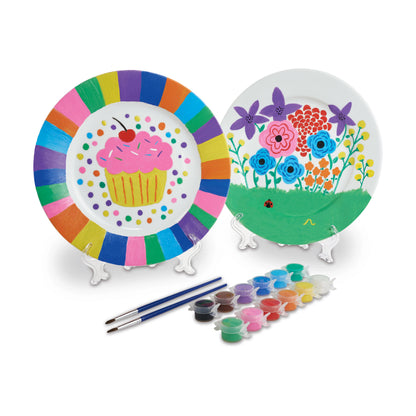 Paint Your Own Porcelain Plates craft kit with two white plates, colorful paints, and brushes