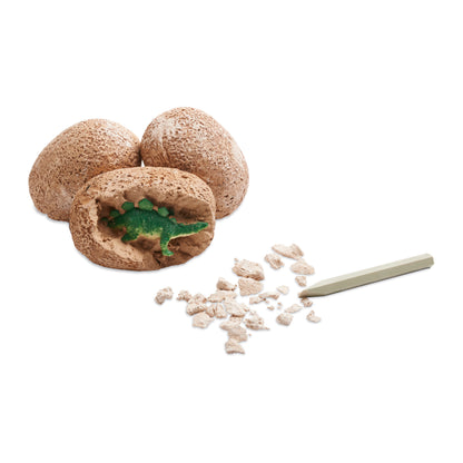 Dig It Up! Dinosaur Eggs toy set with brown excavation eggs, green dinosaur figure, and digging tool