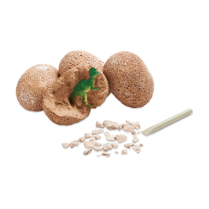 Dig It Up Dinosaur Eggs toy set with brown eggs, green dinosaur figure, and excavation tool