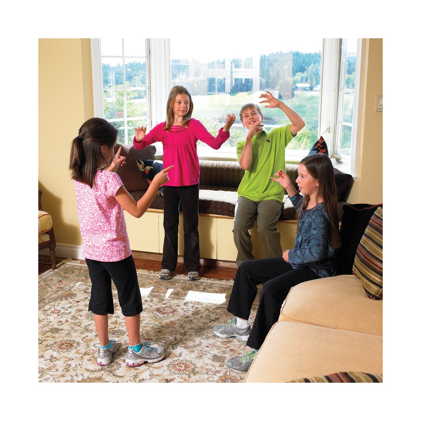 Picture Charades game with kids playing in living room, colorful clothing