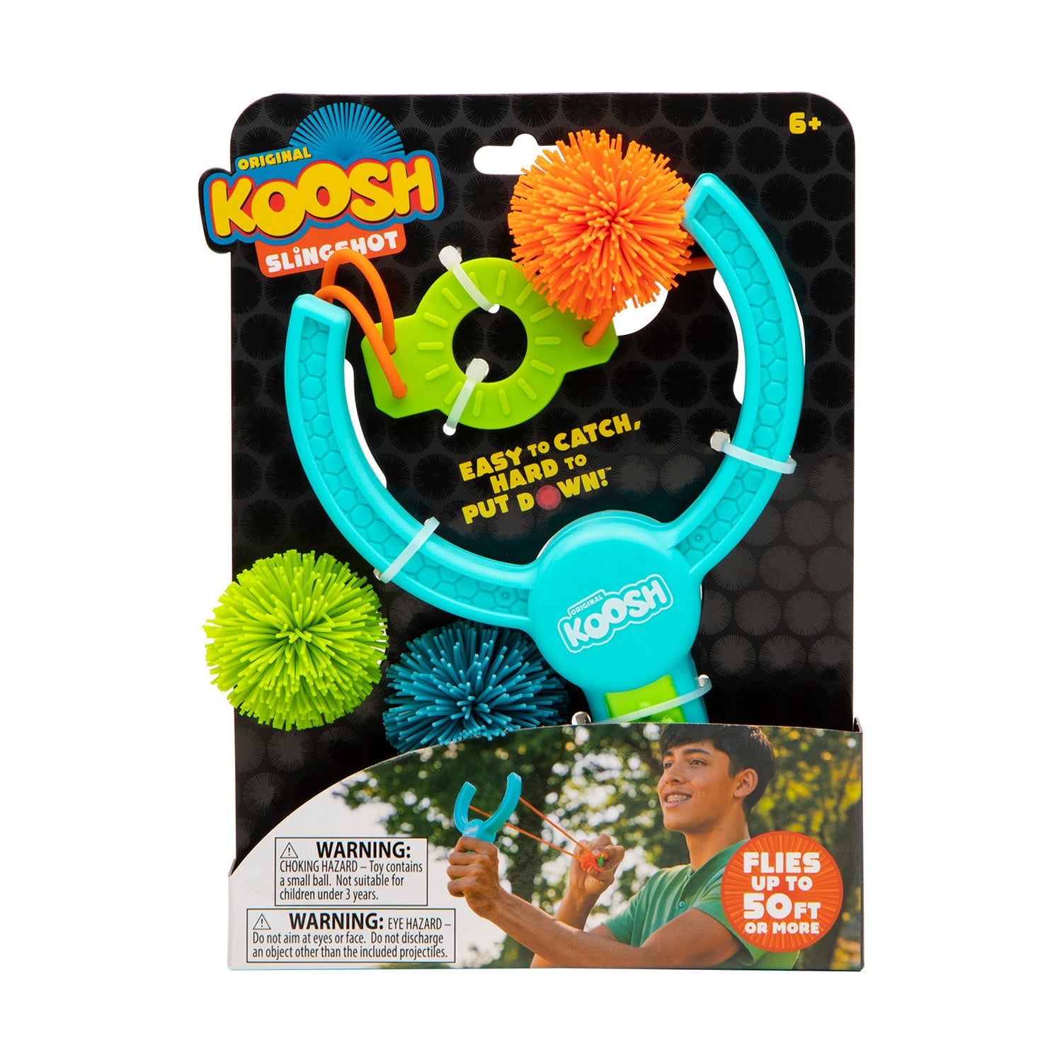 Original Koosh Slingshot toy in turquoise and lime green with three colorful pom-pom projectiles, packaged for ages 6+
