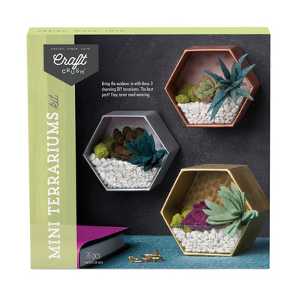 Craft Crush Mini Terrariums Kit box showing three hexagonal terrariums with felt succulents, white stones, and moss in gray, copper, and gold containers
