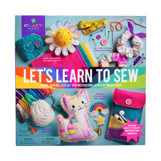Craft-tastic Let's Learn to Sew kit box showing colorful fabric projects including embroidered flower, stuffed cat, pouches, hair scrunchies, and included suppl