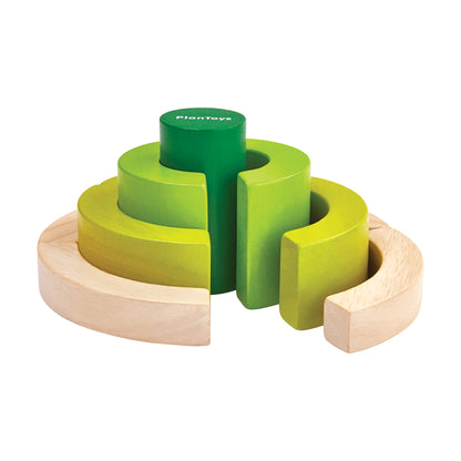 Plan Toys Colorful Curve Blocks Set with wooden base, lime-green and yellow curved blocks, and green center cylinder
