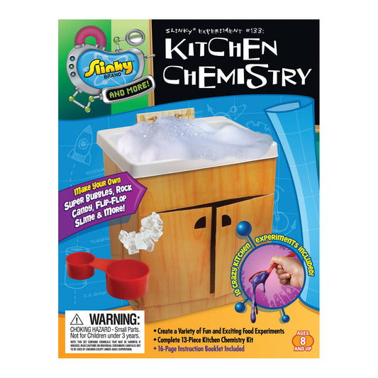 Slinky Science Kitchen Chemistry kit box showing wooden cabinet-style container with white basin top, red measuring cups, and included experiment materials for