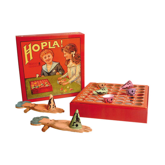 Hopla Flick & Score vintage-style game with red box, wooden hand-shaped flickers, party hats, and game board with scoring holes