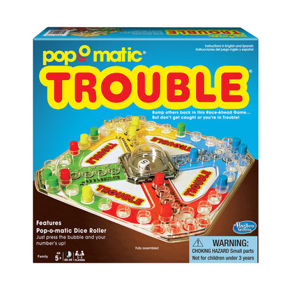 Pop-O-Matic Trouble board game box showing the game board with colorful playing spaces in green, yellow, red, and blue, a central pop-o-matic bubble roller, and