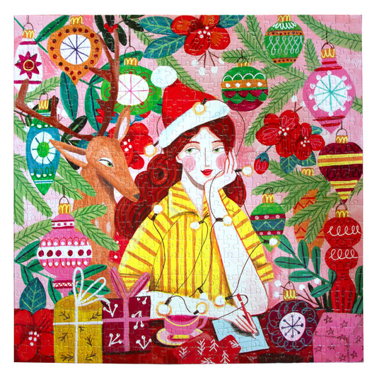 500-piece jigsaw puzzle with festive illustration of girl in yellow jacket and Santa hat surrounded by reindeer, ornaments, gifts, and evergreen branches on pin