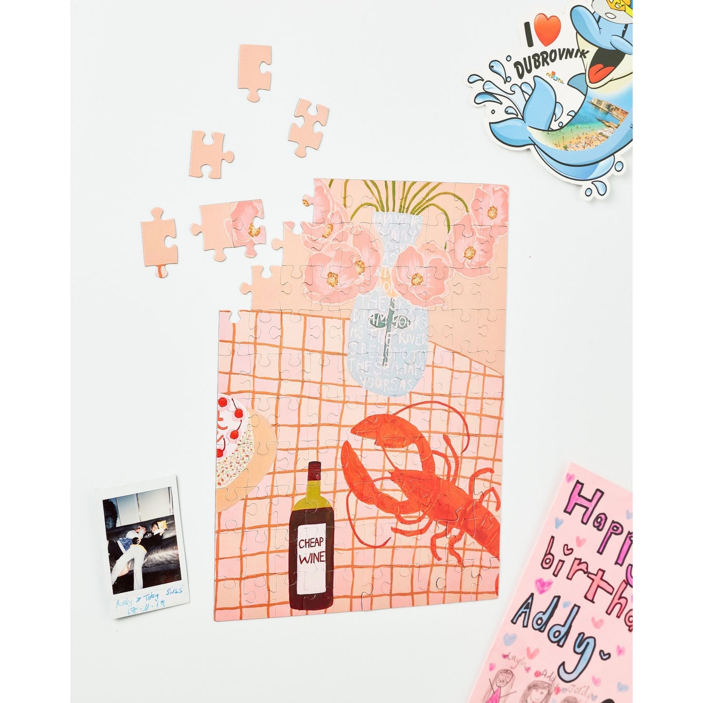 JOS Magnetic Puzzle - Lobster Lunch with red lobster, wine bottle, and pink floral design