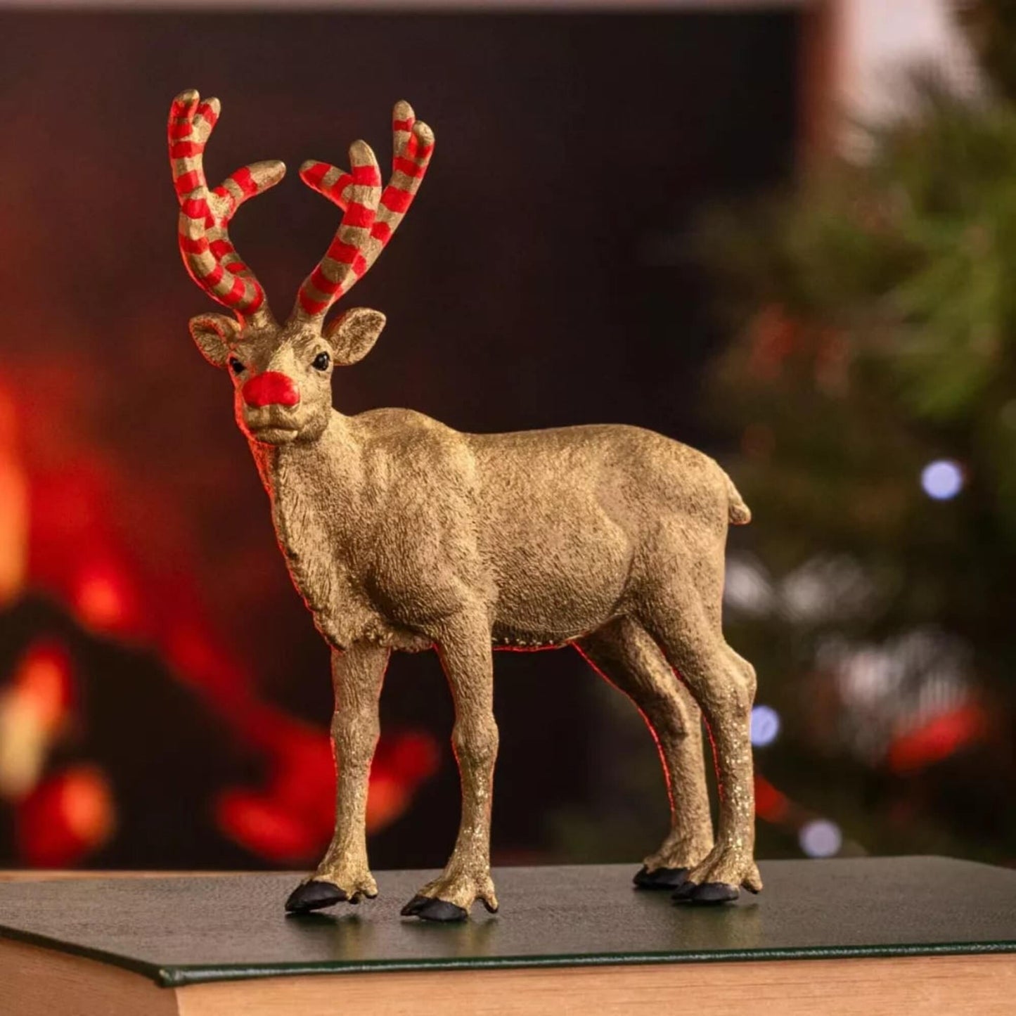 Wild Life Golden Anniversary Reindeer toy with red nose and antlers, gold glitter finish